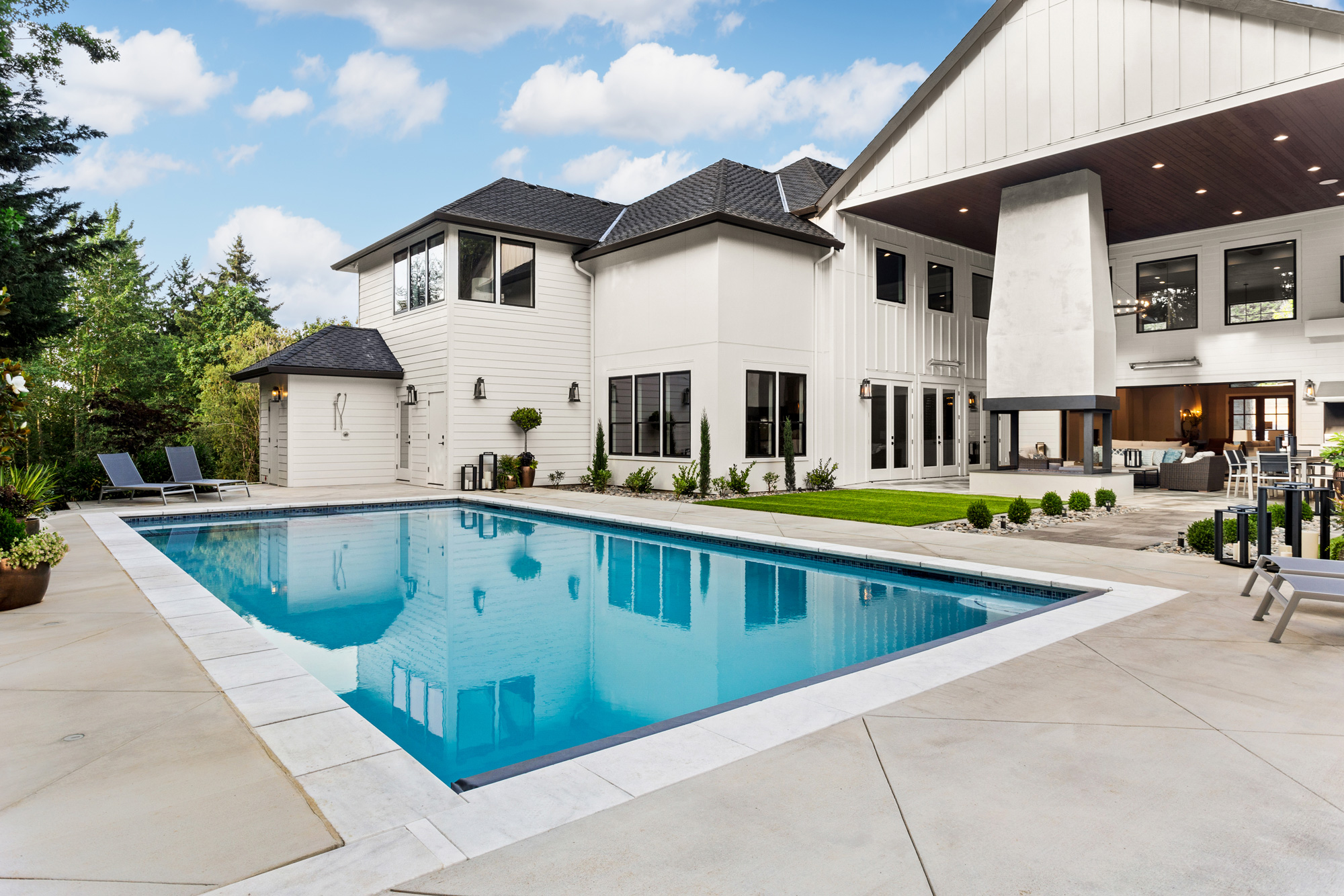 Modern farmhouse home with rectangular swimming pool in Charlotte NC neighborhood